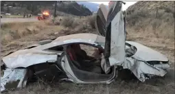  ?? Osoyoos Today ?? The remains of a 2016 Mclaren 570S is seen west of Osoyoos Thursday evening after it left the highway. RCMP believe speed was a factor in the crash.