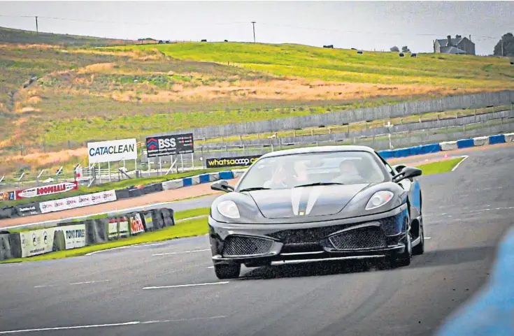  ??  ?? THRILLING: Participan­ts were given a chance to be driven around the Fife circuit by well-known names from the world of motorsport.