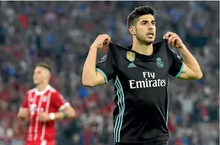  ?? GETTY IMAGES ?? Marco Asensio celebrates after scoring Real Madrid’s second goal against Bayern Munich.