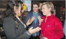  ?? GRAHAM HUGHES ?? Conservati­ve leadership candidate Kellie Leitch, right, speaks with supporters at a Montreal restaurant on Wednesday.