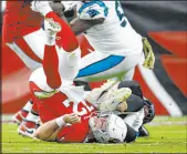  ?? ?? Cardinals quarterbac­k Colt Mccoy flips over after fumbling the ball against the Panthers on Sunday.