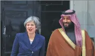  ?? SIMON DAWSON / REUTERS ?? Britain’s Prime Minister Theresa May greets the Crown Prince of Saudi Arabia Mohammad bin Salman outside 10 Downing Street in London on Wednesday.