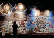  ??  ?? In this May 25 photo, a visitor to the Country Music Hall of Fame and Museum in Nashville, Tennessee, views the the Outlaws & Armadillos exhibit. The exhibit, which runs through 2021, focuses on the counter-culture scene that stretched from Austin to...