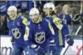  ?? CHRIS O’MEARA — THE ASSOCIATED PRESS ?? Atlantic Division’s Nikita Kucherov, center, of the Tampa Bay Lightning, smiles as he is congratula­ted by Steven Stamkos, left, of the Lightning, and Erik Karlsson, right, of the Senators, after scoring a hat trick during the NHL All-Star game against...