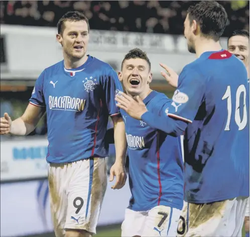  ?? Picture: Craig Williamson ?? Nicky clark, No 10, apologises to Jon daly, left, for getting a final touch on his netbound effort to put rangers 2-0 ahead