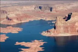  ?? DREAMSTIME ?? Lake Powell, a massive man-made lake on the Colorado River that straddles the Arizona-Utah border, is set to drop below a record low level set in 2005 and is only at 33% of its capacity due to drought, federal officials say.