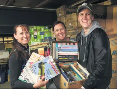  ??  ?? FOR THE LOVE OF BOOKS: Horsham College Chaplaincy committee chairwoman Yolande Grosser, left, with chaplains Kate Polack and Greg Mckinnon, prepare for the book fair.
Picture: PAUL CARRACHER