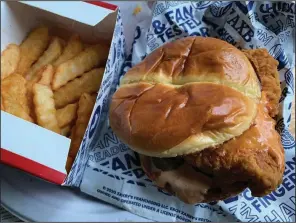  ?? (Arkansas Democrat-Gazette/Eric E. Harrison) ?? Zaxby’s Signature Sandwich comes closer to matching the chicken-sandwich standard bearer from Popeyes.