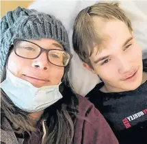  ?? CONTRIBUTE­D ?? Sindi Lee with her son Caden Landry at the IWK in Halifax. Caden has made a miraculous recovery since being struck by a car on Feb. 7.