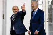  ?? POOL VIA AP ?? Brazilian President Luiz Inacio Lula da Silva and President Joe Biden walk along the West Colonnade to the Oval Office at the White House on Friday.