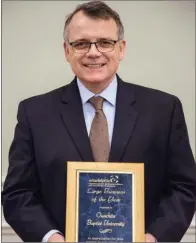  ?? SUBMITTED PHOTOS ?? Ouachita Baptist University President Ben Sells accepts the Large Business of the Year award on behalf of the university.