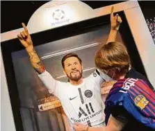  ?? AFP ?? La figura de Lionel Messi en el Madame Tussauds luce diferente.