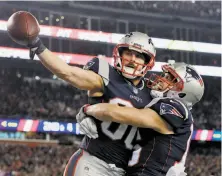  ?? David J. Phillip / Associated Press ?? The Patriots’ Danny Amendola (left) celebrates his go-ahead touchdown catch with fellow wide receiver Chris Hogan.