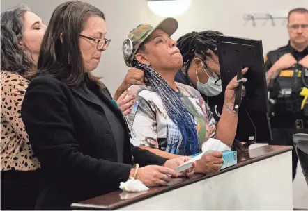  ?? ?? Shawna Brady, center, mother of slain 15-year-old Trévon Dickson, becomes emotional Thursday while her victim impact testimony is read before the sentencing of Nasir Ndiaye in Franklin County Court of Common Pleas Juvenile Division. Ndiaye, now 17, was 15 when he fatally shot Dickson in 2021 in an exchange of gunfire that also wounded Ndiaye.