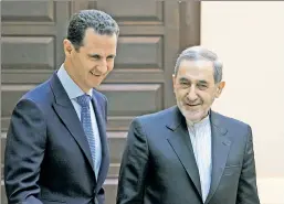  ??  ?? He rode to Damascus: Bashar al-Assad (left) and Iranian adviser Ali Velayati.