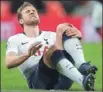  ??  ?? Tottenham striker Harry Kane winces after being injured during Sunday’s defeat to Manchester United at Wembley.