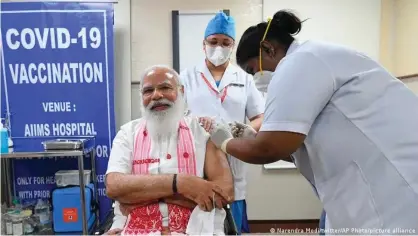  ??  ?? Indian Prime Minister Narendra Modi receives a dose of COVID-19 vaccine in New Delhi. Modi's response to the pandemic has drawn widespread criticism.