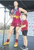  ??  ?? Jake Dignan, with son Harry, receiving the Joe Grant Medal.