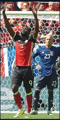  ??  ?? SKY HIGH: Romelu Lukaku celebrates Belgium’s opening goal as Ireland’s Darren Randolph looks on