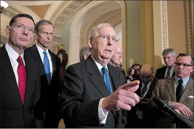  ?? AP/J. SCOTT APPLEWHITE ?? Senate Majority Leader Mitch McConnell, joined by fellow Republican Sens. John Barrasso of Wyoming and John Thune of South Dakota, speaks Tuesday after a strategy session at the Capitol in Washington. The Senate later approved the farm bill.