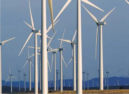  ?? THE ASSOCIATED PRESS/FILES ?? A PacifiCorp wind turbine farm near Glenrock, Wyo. Although the Obama administra­tion has given initial approvals to 46 wind and solar projects on public lands since 2009, just 15 are in operation.