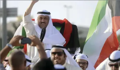  ??  ?? In this April 20, 2015 file photo, supporters celebrate with opposition leader Musallam al-Barrack in Kuwait City after his release on bail ahead of a final decision on charges he insulted the country’s ruler. A lawyer said on Monday, that a Kuwaiti...