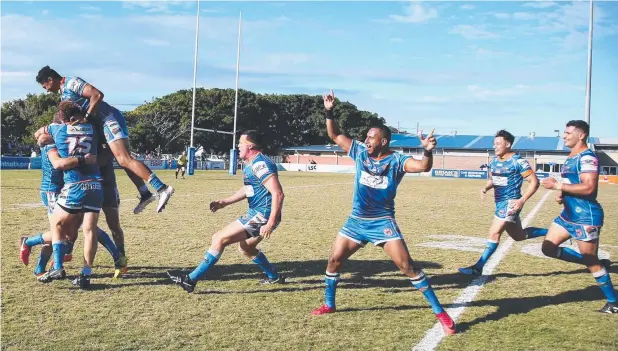  ?? Picture: SUPPLIED. ?? TOP SHOW: Pride players congratula­te Jake Clifford after his conversion, giving the Pride a memorable 30-28 win over the Burleigh Bears at Pizzey Park.