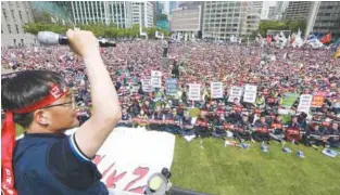  ?? AFPPIX ?? ... Unionised workers stage a May Day rally in front of City Hall in Seoul yesterday. Tens of thousands of South Koreans took part in May Day protests to criticise labour reforms pushed by the government and to call for a higher minimum wage.