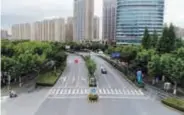  ?? ?? Driverless vehicles are seen moving along the open roads for autonomous driving in Jiading. — Hu Xindong