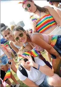  ??  ?? ABOVE: Daisey Palmisano, Emily Cherwin, Debbie Garcia, and Sylkia Hernandez, of Norwich, Conn., from left, have fun at RI Pride Fest.