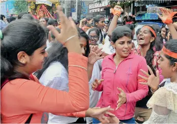  ?? — P. SURENDRA ?? Girls dancing during a procession of Ganesh idols being taken from Himayathna­gar to Tank Bund.