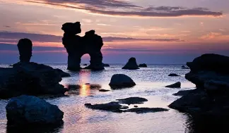  ?? ?? Sculptural sea stacks are a popular tourist attraction on Gotland Getty Images