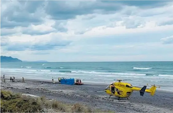  ??  ?? The woman was dragged from the water alive and paramedics administer­ed CPR on the beach but she could not be saved.