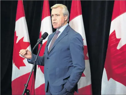  ?? ANDREW VAUGHAN/CP ?? Premier Dwight Ball talks to reporters as the federal Liberal cabinet meets in St. John’s Tuesday.