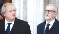  ?? (Henry Nicholls/Reuters) ?? BRITAIN’S PRIME MINISTER Boris Johnson and Labour Party leader Jeremy Corbyn attend a vigil for victims of a fatal attack on London Bridge earlier this month.