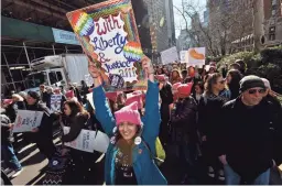  ?? ANNE-MARIE CARUSO/USA TODAY NETWORK – NEW JERSEY ?? Arati Kreibich, of the Borough Council of Glen Rock, N.J., holds up a sign at the Women’s March in New York.