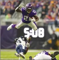  ?? JEFF WHEELER/TRIBUNE NEWS SERVICE ?? Minnesota Vikings running back Jerick McKinnon went high at the end of a 15-yard run on Nov. 19, 2017 in Minneapoli­s, Minn.