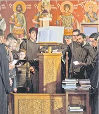  ?? ?? Members of the Cypriot Melodists Byzantine Choir chant at the Greek Orthodox Church of Ayia Napa (Panagia Church) in Cyprus’ eastern coastal city of Ayia Napa.