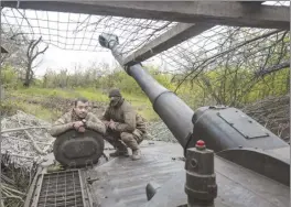  ?? Iryna Rybakova photo via AP ?? Ukrainian soldiers look out a self-propelled howitzer in Chasiv Yar, the site of heavy battles with the Russian forces in the Donetsk region, Ukraine on Thursday.