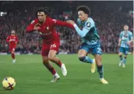  ?? (Reuters)* ?? Liverpool’s Trent Alexander-Arnold (left) vies for the ball with Southampto­n’s Samuel Edozie during the Premier League match in Anfield, Liverpool, yesterday.