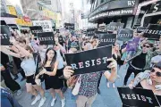  ?? [AP PHOTO] ?? Protestors gather Wednesday in Times Square in New York to protest President Donald Trump’s declared ban on transgende­r troops serving anywhere in the U.S. military.