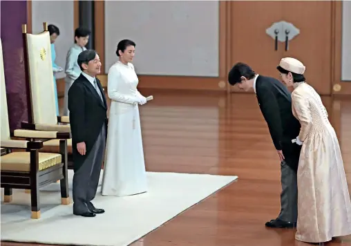  ?? AFP ?? Japan new Emperor Naruhito (left) and Empress Masako listen to congratula­tory words from Crown Prince Akishino and Crown Princess Kiko during an event to receive a celebratio­n of the accession to the throne at the Imperial Palace in Tokyo on Wednesday. —