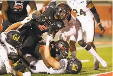  ?? Rick Bowmer / Associated Press ?? Utah’s Zack Moss reaches the end zone while scoring one of his two touchdowns in his a win over Cal in Salt Lake City.