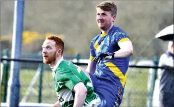  ??  ?? Conor Griffin scores a point for Calry/St Joseph’ as Bunninadde­n’s Sean Leamy watches. Pic: Tom Callanan.