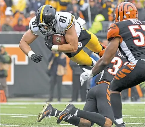  ?? Matt Freed/Post-Gazette ?? Steelers tight end Jesse James goes for extra yardage after a reception Sunday in Cincinnati. James has 17 receptions this season — seventh most among AFC tight ends and just behind teammate Vance McDonald.