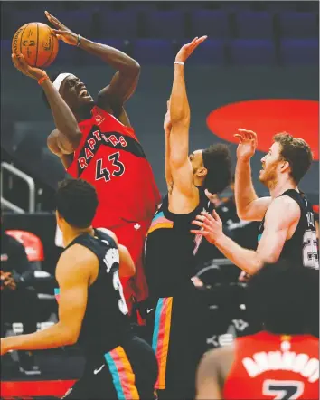  ?? — NATHAN RAY SEEBECK/USA TODAY SPORTS ?? Raptors forward Pascal Siakam shoots over San Antonio Spurs guard Derrick White during Wednesday at Amalie Arena in Tampa, Fla.