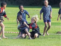  ?? Picture: SHANI LOMBAARD ?? STARTING YOUNG: Shaw Park Primary School played a friendly rugby match against El Shaddai Christian Academy last week, which saw the U9 boys practise their ball-handling skills. Carter Stewart from Shaw Park made the tackle