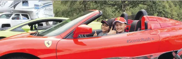  ??  ?? Aidan MacAulay of North Vancouver mans the driver’s seat alongside his buddy Nicholas Daal during the Scenic Rush day trip last summer. Aidan lost his battle to cancer last September.