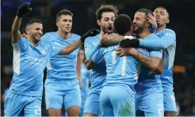  ?? Photograph: Tom Flathers/Manchester City FC/Getty Images ?? Manchester City celebrate Raheem Sterling’s equaliser against PSG.