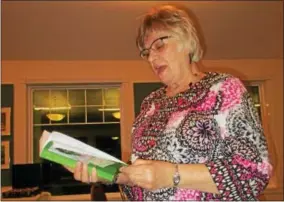  ?? PHOTO SPECIAL TO THE DISPATCH BY MIKE JAQUAYS ?? Jeanne Dunn reads a passage from her book “Where Once There Were Thorns” for the Oneida-Sherrill Lions Club at their Dec. 12meeting at the Lakeview Restaurant in Kenwood.